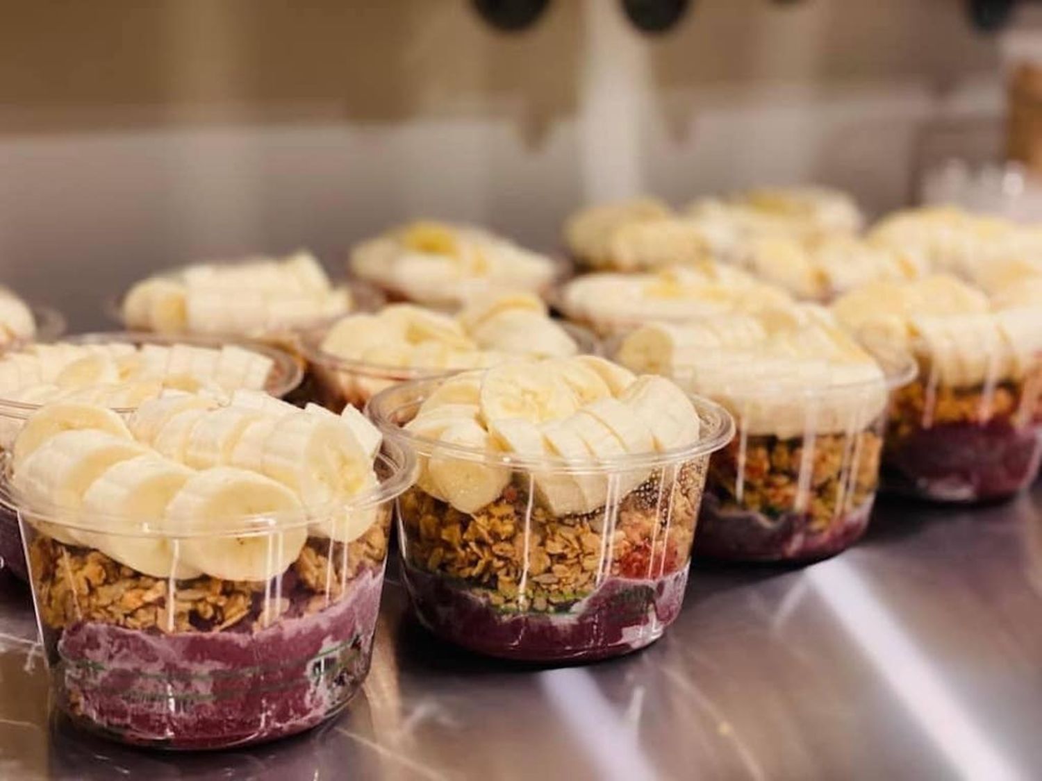 Absolute Health Bowls topped with granola and banana